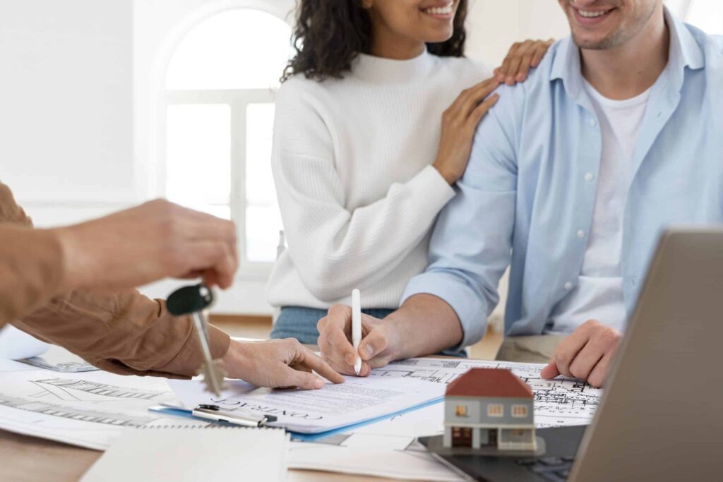 smiley-couple-signing-contract-new-house-scaled2